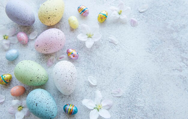 Top view of colorful easter eggs on concrete background