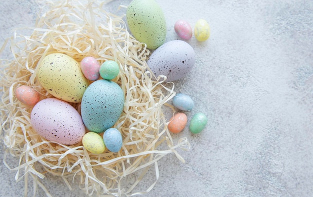 Top view of colorful easter eggs on concrete background