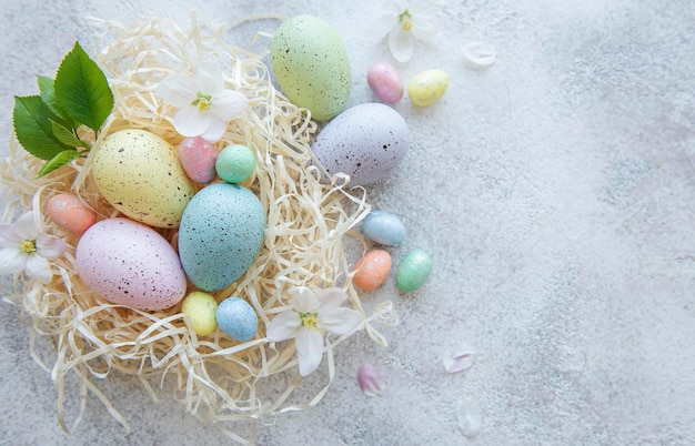 Top view of colorful easter eggs on concrete background