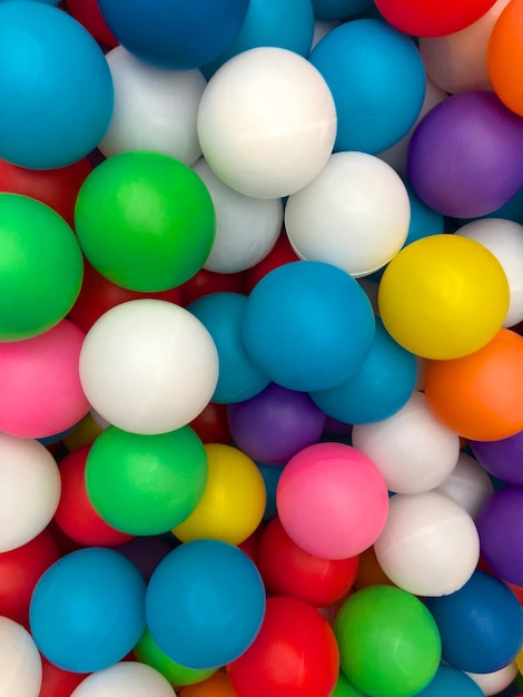 Top view colorful plastic balls in a pool Plastic colorful balls for playing Colorful plastic