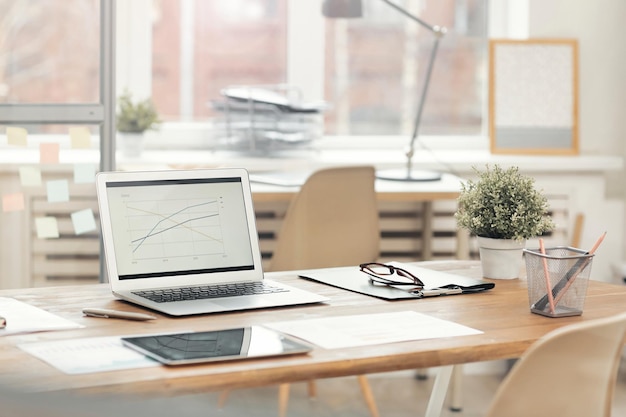 Top view of comfortable vintage workplace with office supplies and copy space on white table