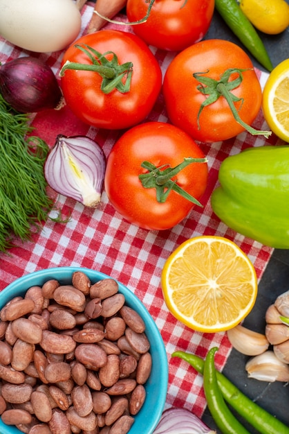 top view cooked beans with greens and fresh vegetables on dark background color meal lunch snack salad food health diet