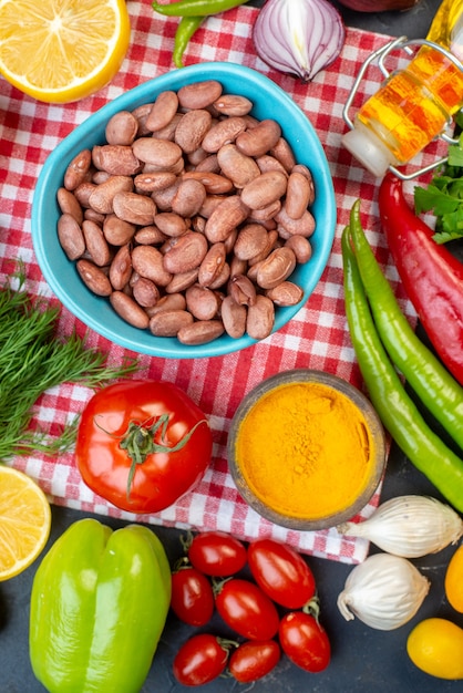 top view cooked beans with greens and fresh vegetables on dark background meal lunch snack color food health diet