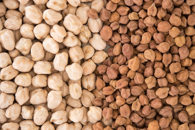 Top view of cooked and raw chickpeas