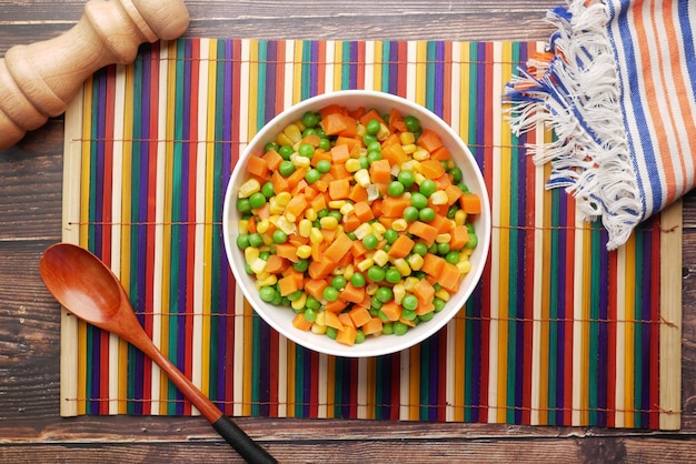 Top view of corn carrot and beans in a bowl