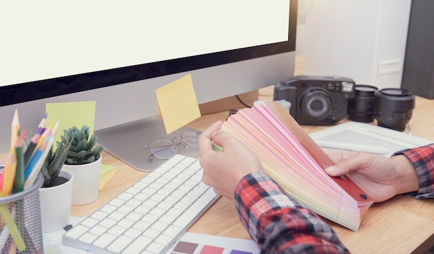 Top View of creative table working Place for graphic design.