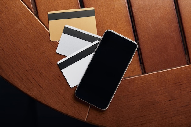 Top view of credit cards and smartphone with copy space