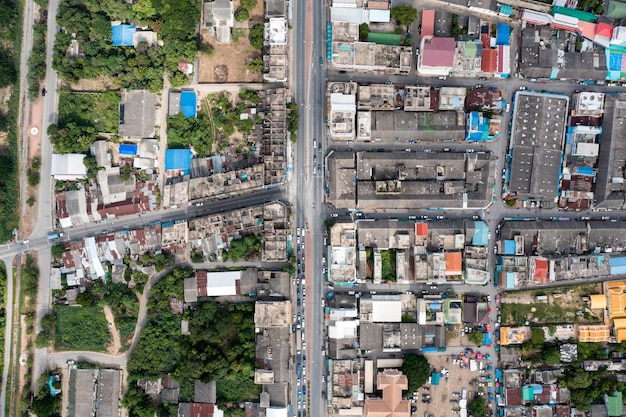 Top view of Crowded commercial building and residential in rural neighborhood and traffic on road in district