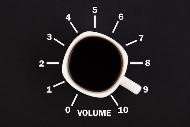 Photo top view of a cup of coffee in the form of volume control from minimum to maximum level