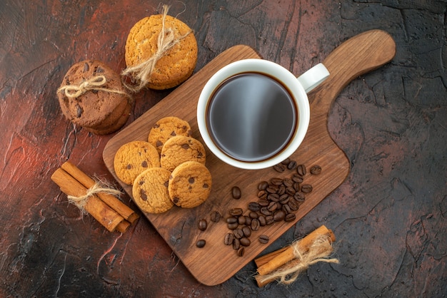 top view cup of coffee with biscuits on dark background color morning sweet breakfast fruit ceremony tea cookie