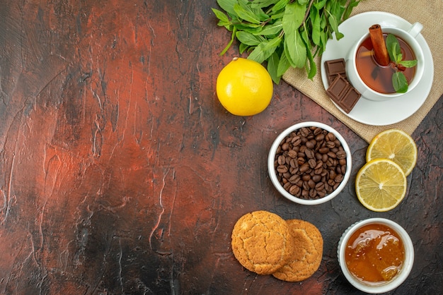 top view cup of coffee with biscuits and tea on dark background sugar cookie color morning breakfast cocoa sweet tea free space