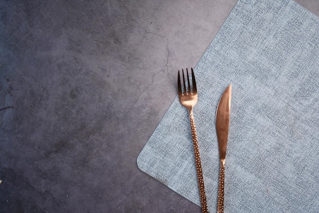 Top view of cutlery on black background