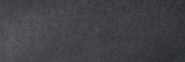 Top view of dark soft and smooth textile material textured background natural black fabric