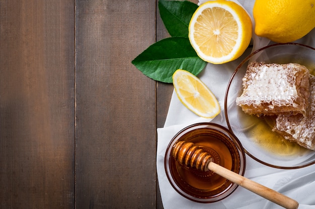 Top view delicious cake with honey and lemon