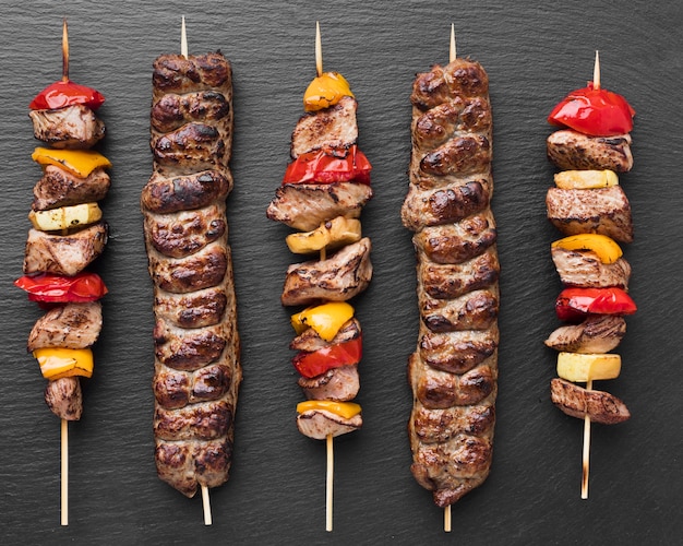 Top view of delicious kebab with vegetables and meat