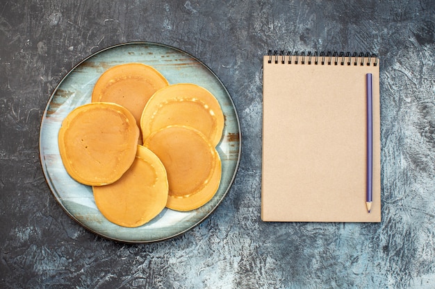 top view delicious little pancakes with notepad on gray background honey sugar breakfast morning food family bake dough jelly