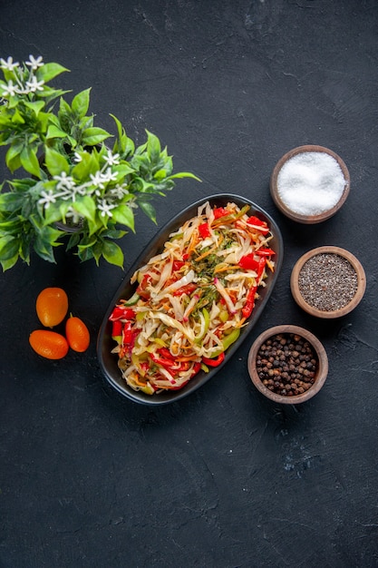 top view delicious pepper salad inside long plate with seasonings dark background meal diet colour health food horizontal dish