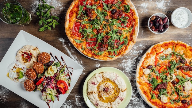 Top view of a different colorful meals on the table covered by flour