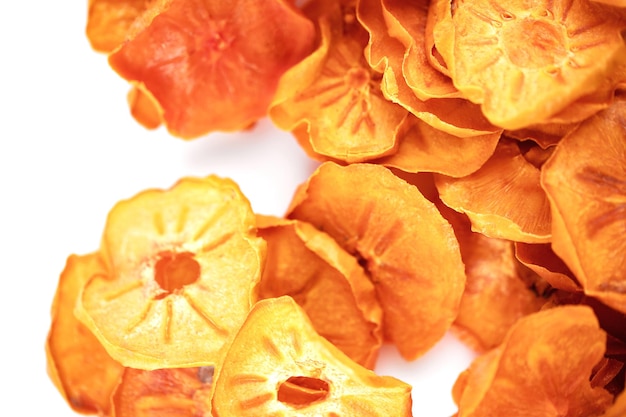 Top view of dried apple chips isolated on white