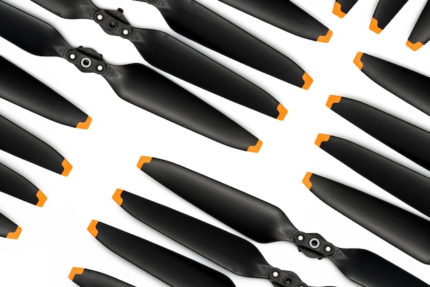 Top view of drone propeller blades on white Drone propellers made from plastic carbon fiber Spare