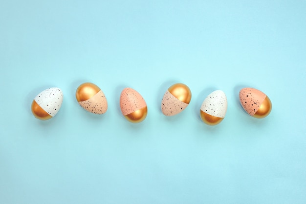 Top view of easter eggs colored with golden paint