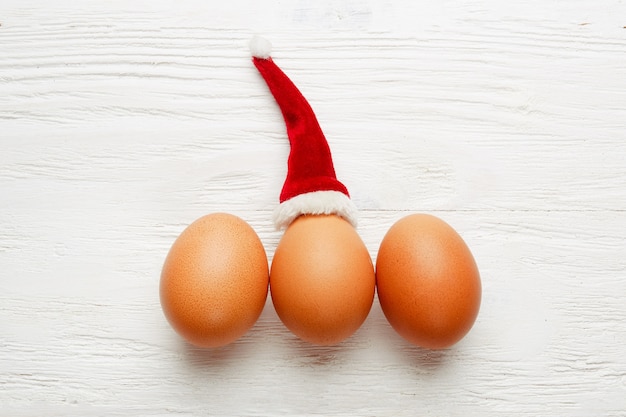 top view eggs on table with Santa hat