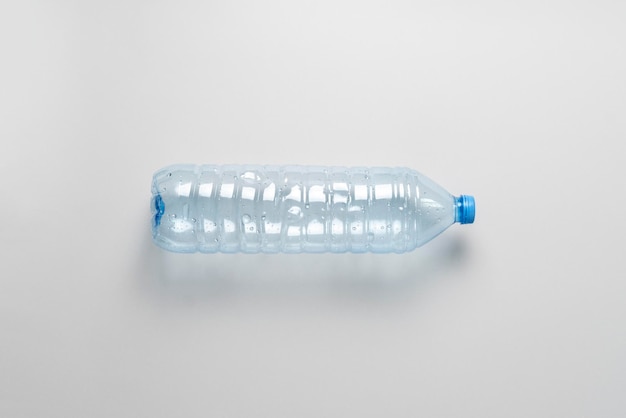 A top view of empty blue plastic bottle