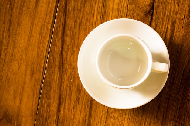 Top view empty white coffee cup on wooden table