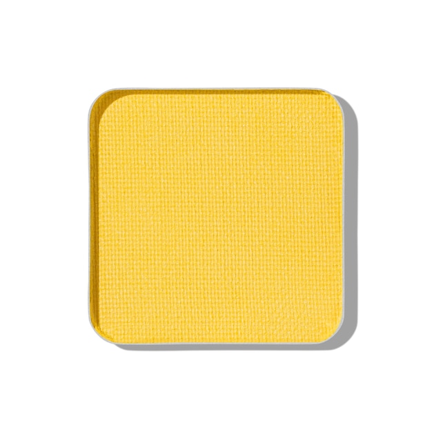 Top view eye shadow yellow swatch object isolated on white background with shadow