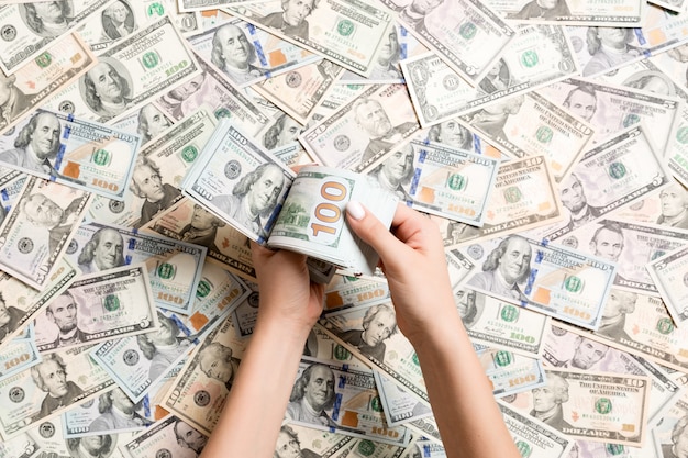 Top view of female hands counting money