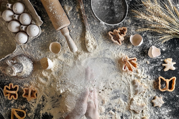 Top view female hands prepares a place for cooking dough