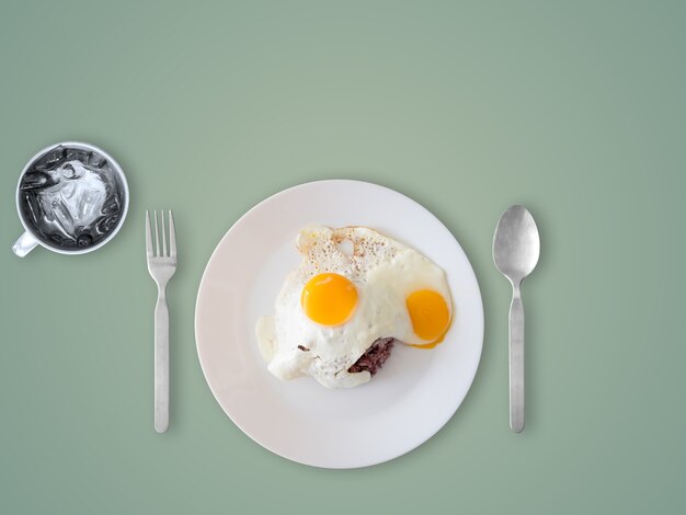 Top view of fired eggs with rice. Simple popular Thai style meal.