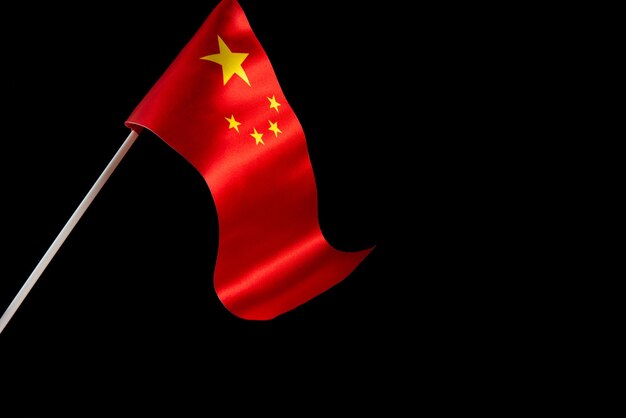 Top view flag of the peoples republic of china isolate with copy space on dark background the flag o