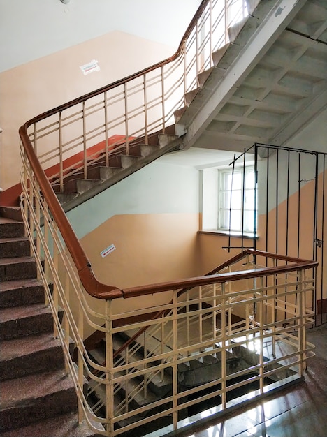 Top view on the flight of stairs of a tall old building