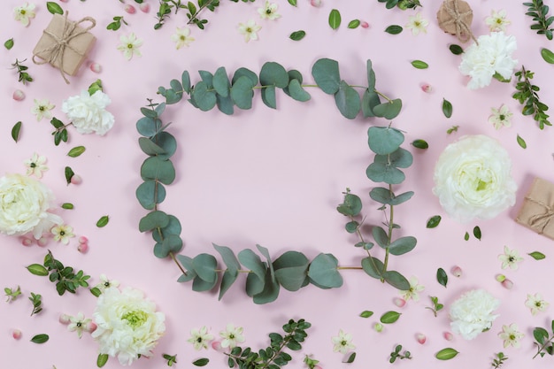 Top view of flower frame isolated on white background, flat lay