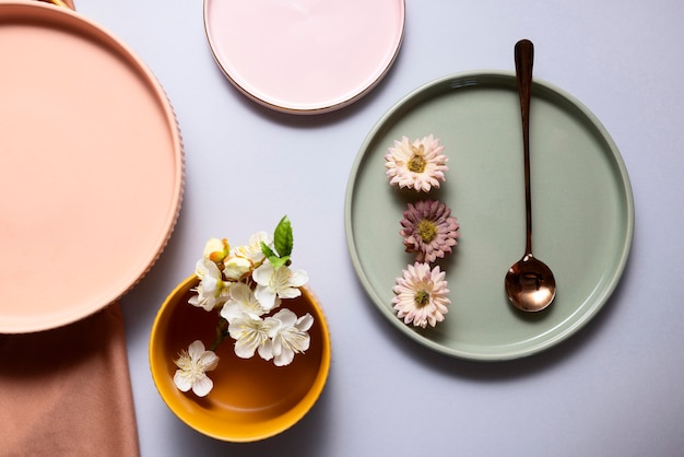 Top view flowers on plates arrangement