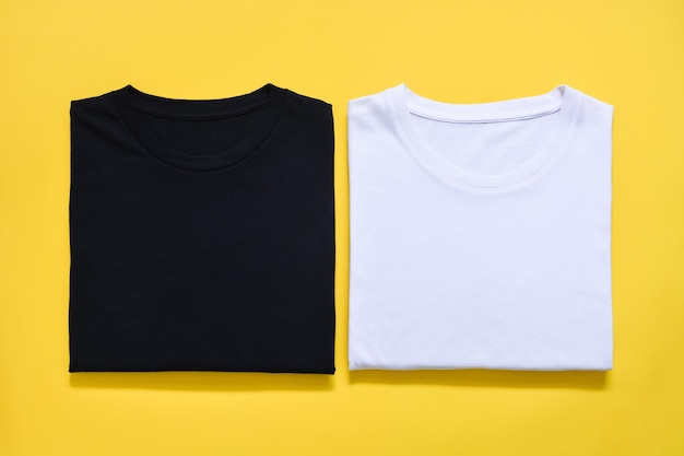 Top view of folded black and white color t-shirt