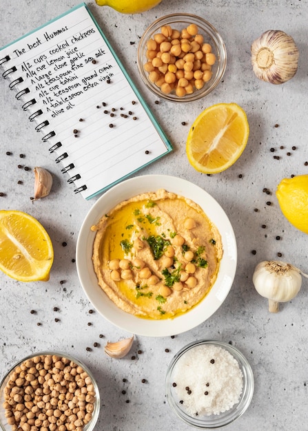 Photo top view of food ingredients with chickpeas in bowl