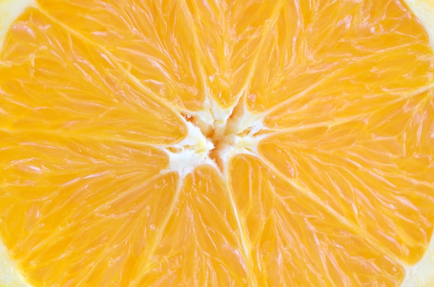 Top view of a fragment of the orange fruit slice close up. 