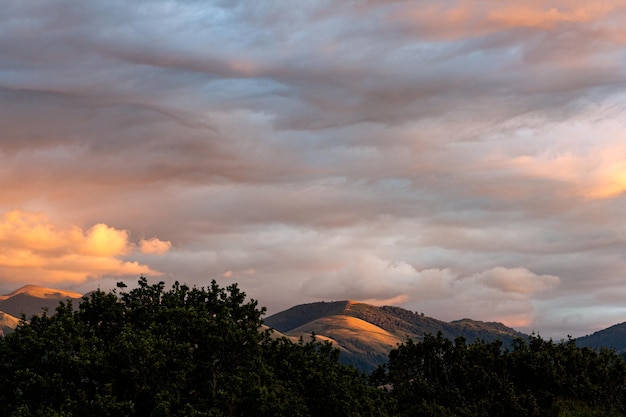 Top view of the french hills on the cloudy sky at sunset