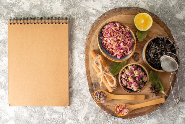 Top view fresh black tea with flowers on white background breakfast ceremony flavor fruit food color morning flowers