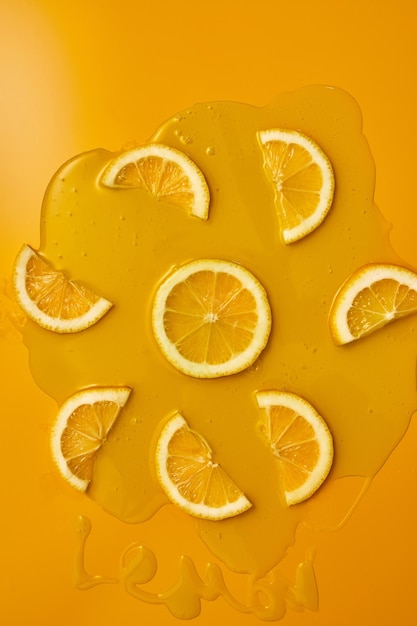 Top view of fresh slice lemons juice and gel serum organic cosmetics