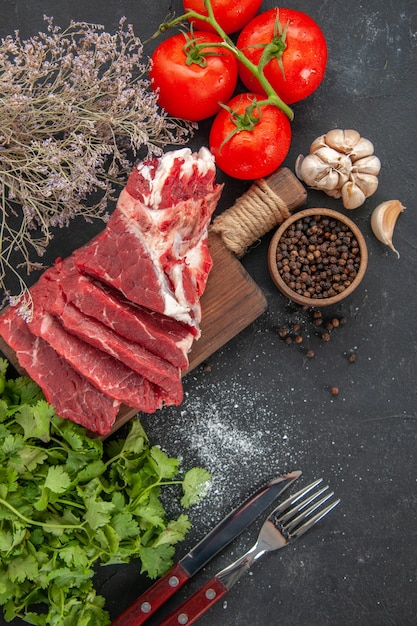 top view fresh sliced meat with pepper and tomatoes