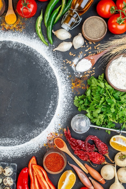 Top view of fresh various foods set with flour around