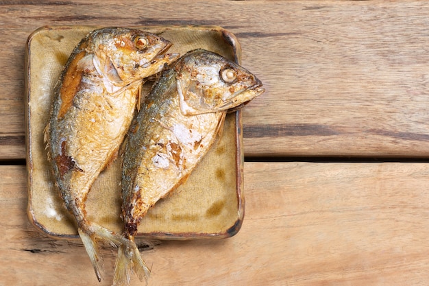 Top view of Fried Mackerel on Wooden Table.