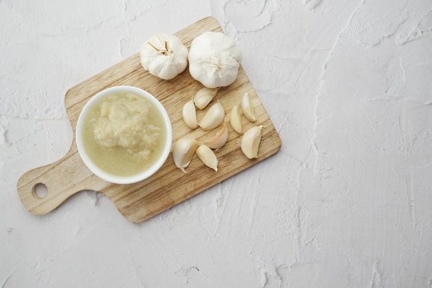 Top view of garlic paste on white background