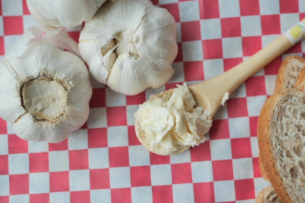 Top view of garlic spread on a spoon