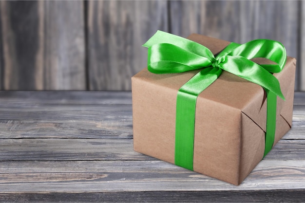 Top view Gift box with ribbon on wooden background