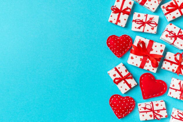 Top view of gift boxes and red textile hearts