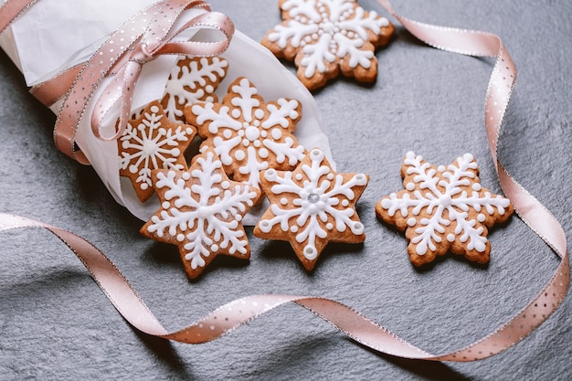 Top view of gingerbread cookies on napkin on the slate table